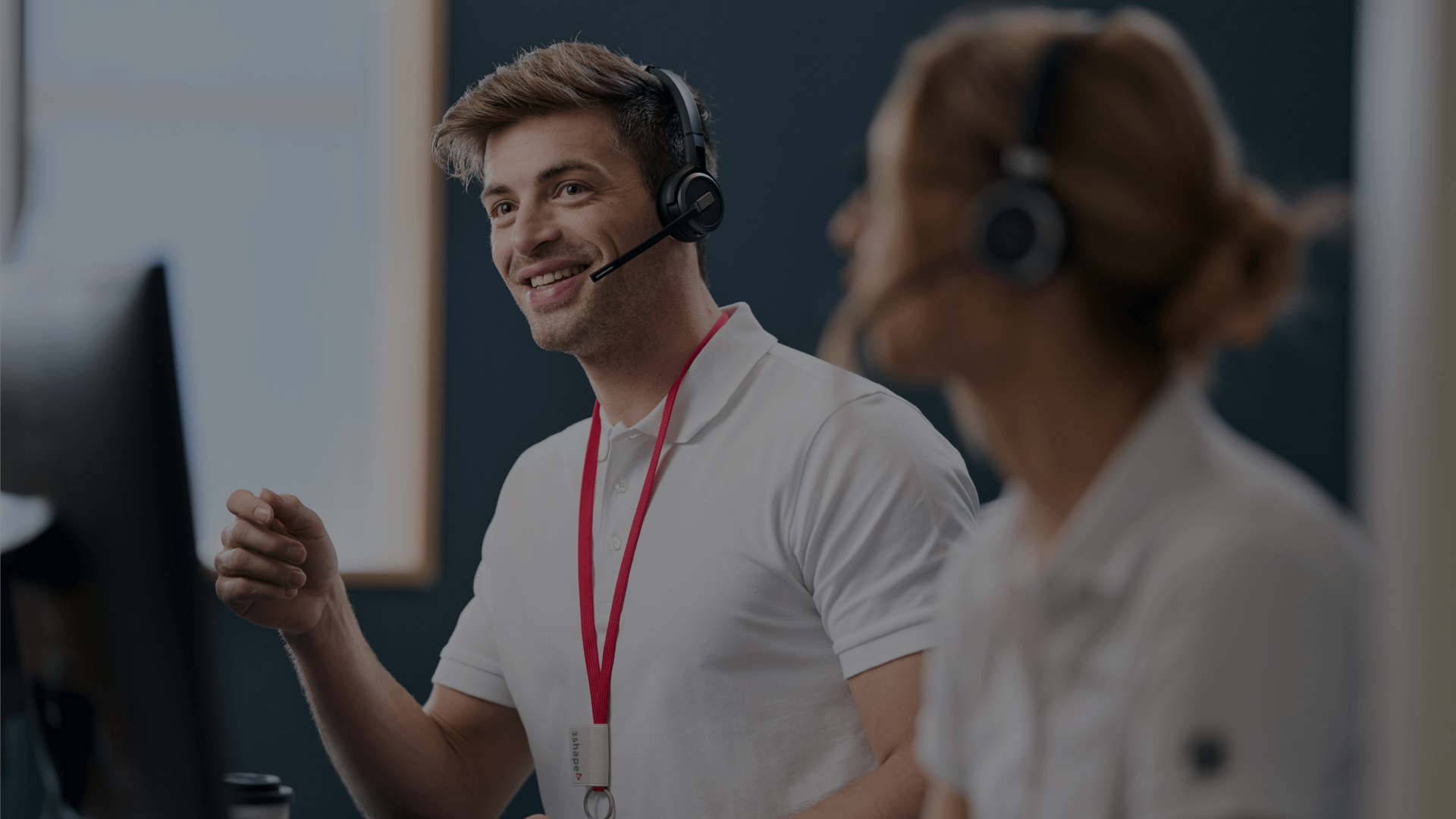 People wearing headsets, discussing work